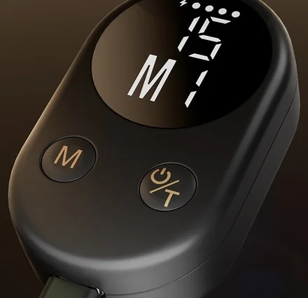 Close-up of the remote with a mode button and a timer button